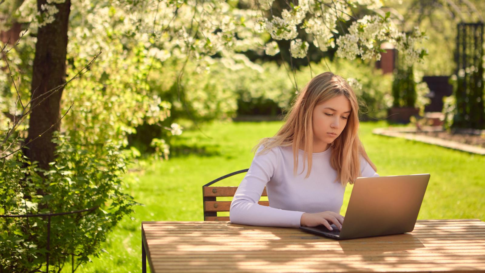 woman with computer outside