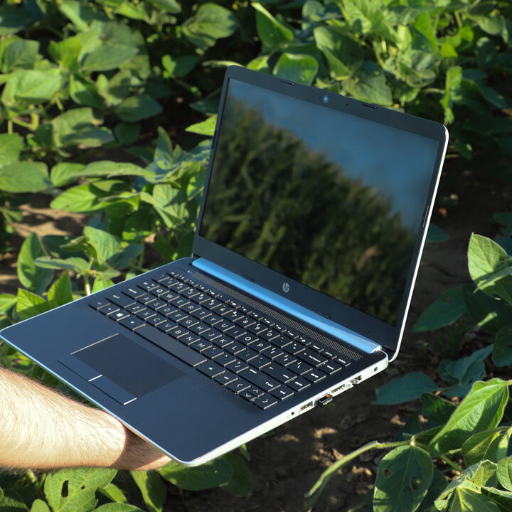 computer in soybean field